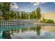 Tranquil pool with patterned tile accents and waterfall features, creating a serene environment at 11990 Montague St, Las Vegas, NV 89138