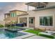 Beautiful backyard oasis with sparkling pool, relaxing lounge area, and lush landscaping at 11990 Montague St, Las Vegas, NV 89138