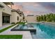 Luxurious pool area with spa and beautifully landscaped backyard, perfect for relaxation at 11990 Montague St, Las Vegas, NV 89138