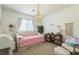 Charming bedroom with plush daybed, chandelier, and bookshelves, ideal for relaxation and reading at 12356 Notch Trail Ave, Las Vegas, NV 89138