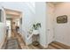 Bright entryway featuring wood floors, white walls, and a staircase with white railing at 12356 Notch Trail Ave, Las Vegas, NV 89138