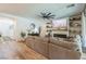 Inviting living room with wood floors, modern fireplace, and a comfortable sectional sofa at 12356 Notch Trail Ave, Las Vegas, NV 89138