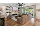 Comfortable living room with a fireplace, built-in shelves, and access to the backyard at 12356 Notch Trail Ave, Las Vegas, NV 89138