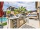 Backyard outdoor kitchen boasts a built-in grill, beverage cooler, and counter space at 12356 Notch Trail Ave, Las Vegas, NV 89138