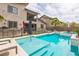 Backyard features a refreshing swimming pool and hot tub, perfect for summer gatherings at 12356 Notch Trail Ave, Las Vegas, NV 89138