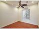 Bedroom with ceiling fan, wood floors and a window with blinds at 2585 Portsmouth Creek Ave, Henderson, NV 89052