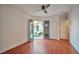 Bedroom featuring wood floors and backyard access through double doors at 2585 Portsmouth Creek Ave, Henderson, NV 89052