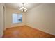 Bright dining room featuring a modern chandelier and a large window at 2585 Portsmouth Creek Ave, Henderson, NV 89052