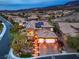 Aerial view of a beautiful home with a tile roof, solar panels, three-car garage, and landscaped yard at 2800 Proust Ct, Henderson, NV 89044