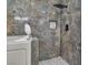 Bathroom featuring marble tiled walk-in shower with stone tiled floors at 2851 S Valley View Blvd # 1098, Las Vegas, NV 89102