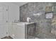 Bathroom features a modern walk-in bathtub and marble tile accents at 2851 S Valley View Blvd # 1098, Las Vegas, NV 89102