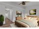 Cozy bedroom with ceiling fan, hardwood floors, and calming neutral decor at 2851 S Valley View Blvd # 1098, Las Vegas, NV 89102