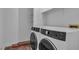 Laundry room with modern appliances and storage shelves at 2851 S Valley View Blvd # 1098, Las Vegas, NV 89102