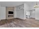 Bright living room with a fireplace, flatscreen TV, hardwood floors and view to the kitchen at 2851 S Valley View Blvd # 1098, Las Vegas, NV 89102