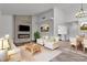 Staged living room with fireplace, white sofas, dining table and kitchen view at 2851 S Valley View Blvd # 1098, Las Vegas, NV 89102