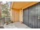 This patio has metal security doors, an outdoor light, and a small amount of decor at 2851 S Valley View Blvd # 1098, Las Vegas, NV 89102