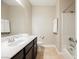Bathroom featuring a bathtub and shower combo, as well as a white sink and vanity at 7119 Saddle Back Peak St, Las Vegas, NV 89166