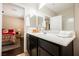 Bathroom featuring a shower and white sink and vanity at 7119 Saddle Back Peak St, Las Vegas, NV 89166