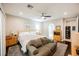 Spacious bedroom with stylish sofa, plush carpeting, and an ensuite bathroom at 7119 Saddle Back Peak St, Las Vegas, NV 89166
