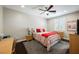 Cozy bedroom with a ceiling fan, wood flooring, and natural light from the window at 7119 Saddle Back Peak St, Las Vegas, NV 89166
