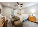 Inviting bedroom features sliding door to patio, plush carpet and ample seating space at 7119 Saddle Back Peak St, Las Vegas, NV 89166