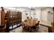Dining area with a wooden table set, decorative screen, and transitions to the living area at 7119 Saddle Back Peak St, Las Vegas, NV 89166