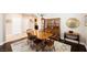 Dining room with hardwood floors, wood furniture, china cabinet, and views of the kitchen at 7119 Saddle Back Peak St, Las Vegas, NV 89166
