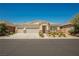 Charming single-story home with a three-car garage, desert landscaping, and neutral color palette for a welcoming curb appeal at 7119 Saddle Back Peak St, Las Vegas, NV 89166