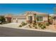 Inviting single-Gathering home showcasing a three-car garage, stone accents, and manicured landscaping for a warm ambiance at 7119 Saddle Back Peak St, Las Vegas, NV 89166