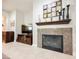 Close up of the living room fireplace, surrounded by decorative tiling and shelving at 7119 Saddle Back Peak St, Las Vegas, NV 89166