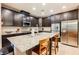 Modern kitchen boasts stainless steel appliances, granite countertops, and a center island at 7119 Saddle Back Peak St, Las Vegas, NV 89166