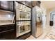 Gourmet kitchen features stainless steel appliances including a double oven and refrigerator at 7119 Saddle Back Peak St, Las Vegas, NV 89166