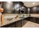 Granite countertops and stainless appliances highlight the modern, functional kitchen space at 7119 Saddle Back Peak St, Las Vegas, NV 89166