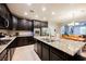 Modern kitchen with stainless steel appliances, granite countertops, and an open layout at 7119 Saddle Back Peak St, Las Vegas, NV 89166