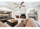 Well lit living room featuring a fireplace and seamless transition into the modern kitchen at 7119 Saddle Back Peak St, Las Vegas, NV 89166