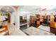 Bright office space with wood floors, ceiling fan, and built-in desk and shelving units at 7119 Saddle Back Peak St, Las Vegas, NV 89166