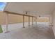 Covered backyard patio with a ceiling fan and concrete flooring, perfect for entertaining guests at 7711 Lofty Hill Ct, Las Vegas, NV 89123