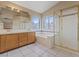 Bathroom with a soaking tub, shower, and double vanity with a large mirror at 7711 Lofty Hill Ct, Las Vegas, NV 89123
