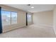 Spacious bedroom features carpet flooring and large windows at 7711 Lofty Hill Ct, Las Vegas, NV 89123