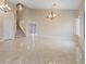 Bright living room boasts tile flooring, neutral walls, and recessed lighting at 7711 Lofty Hill Ct, Las Vegas, NV 89123