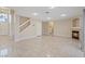 Open living room features neutral walls, tile floors, a fireplace, and recessed lighting at 7711 Lofty Hill Ct, Las Vegas, NV 89123