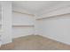 Spacious walk-in closet with ample shelving and room for storage, perfect for organization at 7711 Lofty Hill Ct, Las Vegas, NV 89123