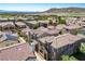 Areal view of a residential area showcasing a community with terracotta rooftops at 1024 Larkspur Point Ct, Las Vegas, NV 89138