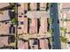 Overhead view of a well-organized residential community with uniform rooftops, manicured landscaping, and neatly arranged streets at 1024 Larkspur Point Ct, Las Vegas, NV 89138
