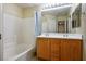 Bathroom showcasing a tub, shower, tile surround, and double sink vanity at 1024 Larkspur Point Ct, Las Vegas, NV 89138