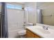 Cozy bathroom with a shower-tub combo and a single sink vanity with white countertops for a clean and efficient design at 1024 Larkspur Point Ct, Las Vegas, NV 89138