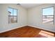 Vacant bedroom featuring hardwood floors and dual windows with outside views at 1024 Larkspur Point Ct, Las Vegas, NV 89138