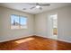 Bedroom with hardwood floors, ceiling fan, and ensuite bathroom with vanity at 1024 Larkspur Point Ct, Las Vegas, NV 89138