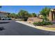 Community entrance sign surrounded by greenery, offering a glimpse into the neighborhood's welcoming atmosphere at 1024 Larkspur Point Ct, Las Vegas, NV 89138