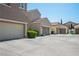 Street view showcasing garage exteriors with well-maintained landscaping and a tidy aesthetic at 1024 Larkspur Point Ct, Las Vegas, NV 89138